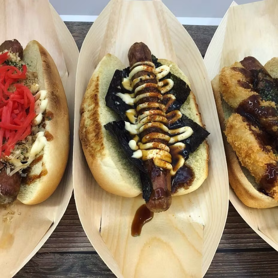 hot dog wrapped in nori with mayo, sauce and togarashi